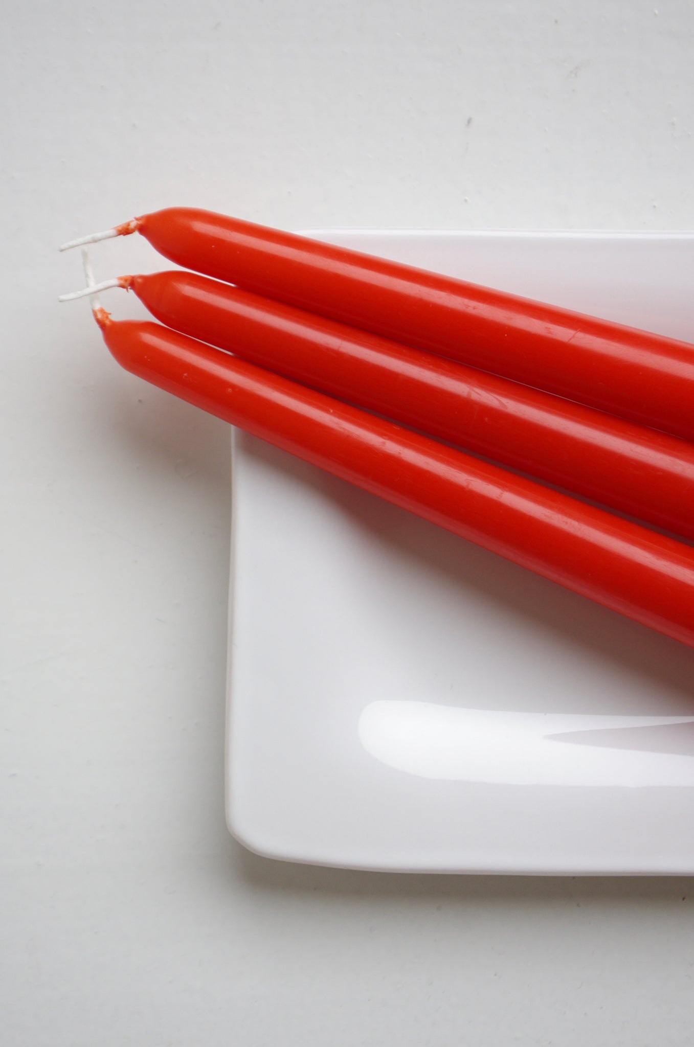 Tapered candles, orange-red, set of 3